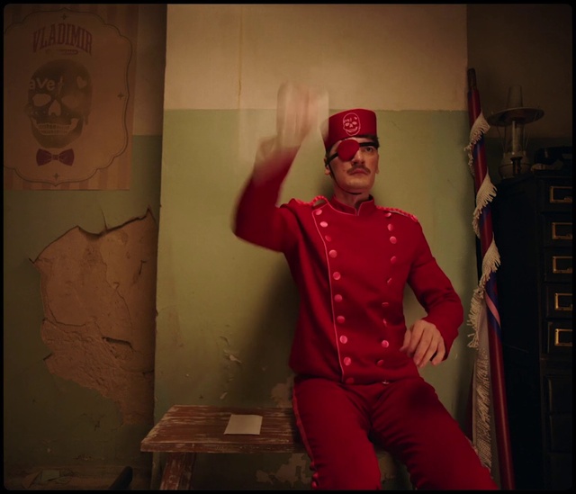 Video Reference: Flash photography, Sleeve, Gesture, Headgear, Hat, Fashion design, Performing arts, Magenta, Entertainment, Art