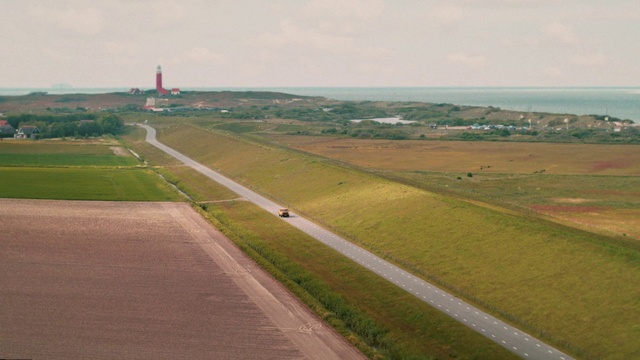 Video Reference: Sky, Ecoregion, Natural landscape, Land lot, Road surface, Asphalt, Runway, Tower, Landscape, Plain