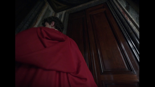 Video Reference: Brown, Wood, Tints and shades, Vestment, Darkness, Event, Magenta, Cape, Room, Religious institute