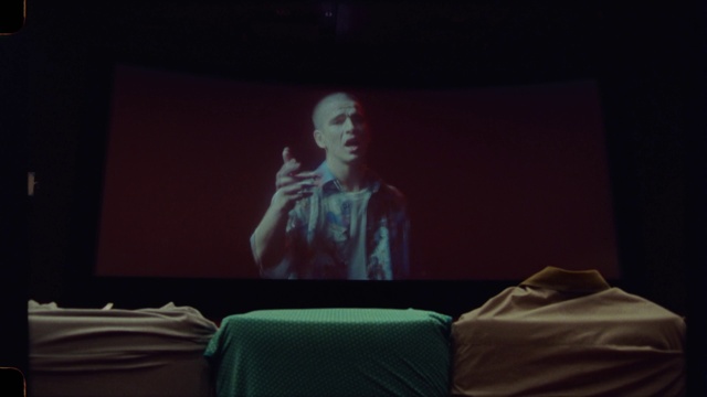 Video Reference: Entertainment, Projection screen, Event, Performing arts, Display device, Stage, Room, Darkness, Multimedia, Projector accessory