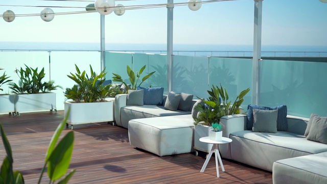 Video Reference: Sky, Plant, Couch, Furniture, Table, Property, Azure, Water, Interior design, Comfort