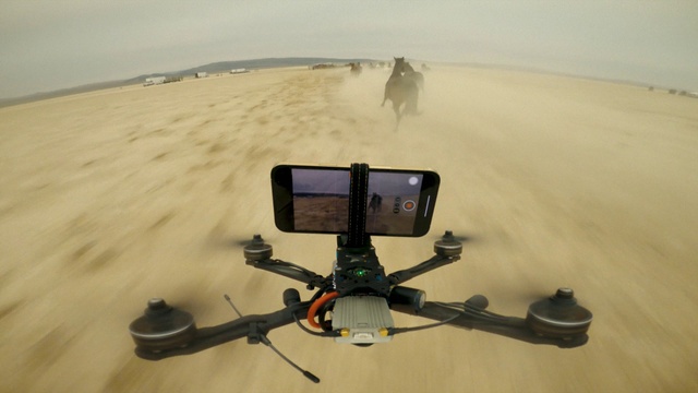 Video Reference: Vehicle, Automotive mirror, Sky, Bicycle handlebar, Automotive tire, Landscape, Beach, Personal protective equipment, Singing sand, Aeolian landform