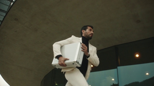 Video Reference: Gesture, Formal wear, Event, White-collar worker, Performing arts, Speech, Audio equipment, Elbow, Job, Orator