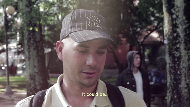 Video Reference: Forehead, Lip, Hairstyle, Neck, Jaw, Cap, Tree, Plant, Baseball cap, Street fashion