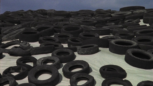 Video Reference: Tire, Sky, Automotive tire, Black, Tread, Synthetic rubber, Rim, Font, Material property, Automotive wheel system