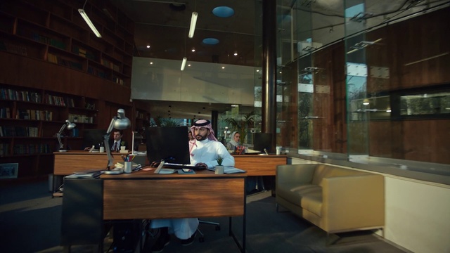 Video Reference: Furniture, Table, Couch, Building, Interior design, Flooring, Desk, studio couch, Bookcase, Glass