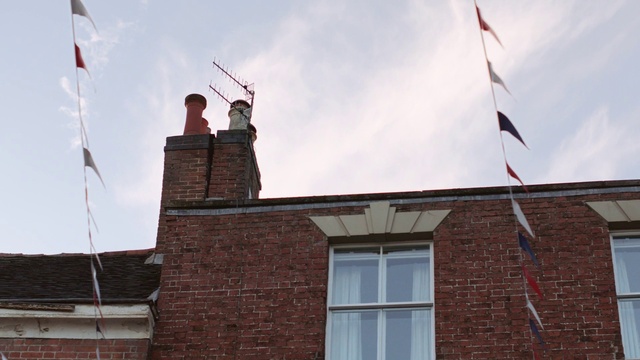 Video Reference: Sky, Cloud, Building, Window, Flag, House, Brickwork, Brick, Facade, Roof