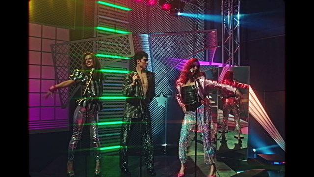 Video Reference: Musician, Dress, Purple, Music, Microphone, Performing arts, Music artist, Entertainment, Artist, Visual effect lighting