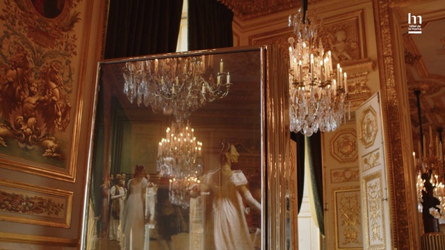 Video Reference: Decoration, Candle, Interior design, Chandelier, Event, Ceiling, Suit, Formal wear, Function hall, Room