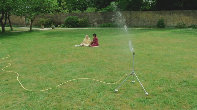 Video Reference: Plant, Hoop (rhythmic gymnastics), Tree, People in nature, Land lot, Grassland, Grass, Recreation, Meadow, Grass family