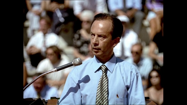 Video Reference: Microphone, Shirt, Public address system, Tie, Dress shirt, Audio equipment, Spokesperson, Adaptation, Hearing, Microphone stand