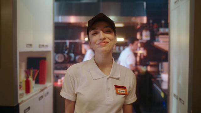 Video Reference: Smile, Hat, Cabinetry, Cap, T-shirt, Fun, Room, White-collar worker, Kitchen appliance, Job