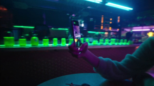 Video Reference: Purple, Entertainment, Gesture, Visual effect lighting, Electricity, Music, Fun, Drink, Magenta, Display device