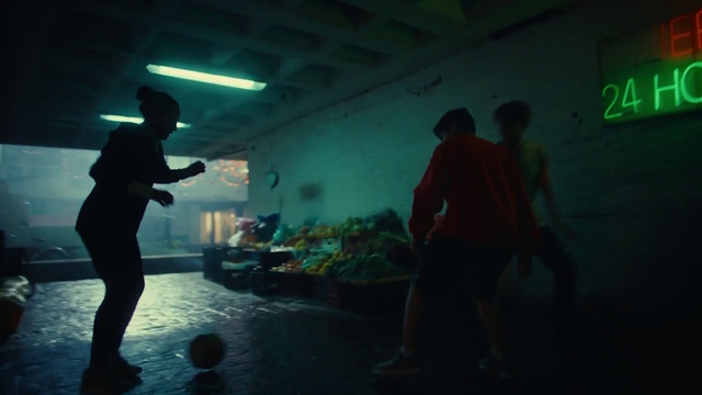 Video Reference: Green, Shorts, Standing, Flash photography, Entertainment, Fun, Event, Darkness, Performing arts, Art