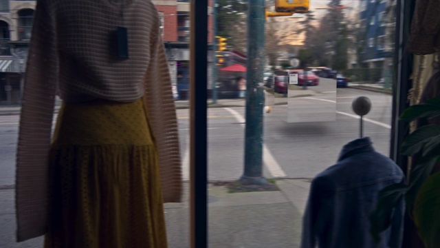 Video Reference: Fashion, Sleeve, Building, Standing, Grey, Car, Road surface, Waist, Sidewalk, Tree