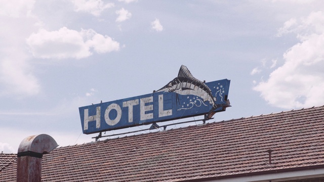 Video Reference: Cloud, Sky, Font, Cumulus, Facade, Gas, City, Signage, Electric blue, Roof