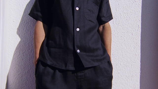 Video Reference: Dress shirt, Dress, Neck, Sleeve, Gesture, Grey, Collar, Waist, Blazer, Denim