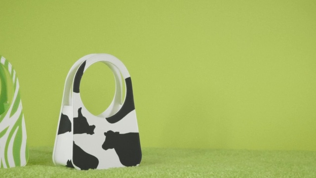 Video Reference: Drinkware, Grass, Audio equipment, Font, Art, Terrestrial animal, Circle, Gadget, Grassland, Symbol