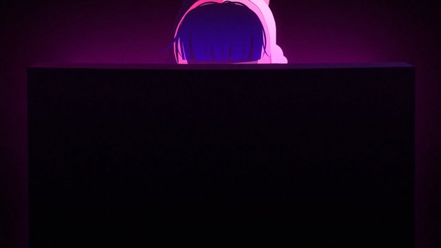 Video Reference: animation, anime, character, headphones, blue hair, pink, purple background, partially hidden, dark scene, screen, foreground obstruction, digital art