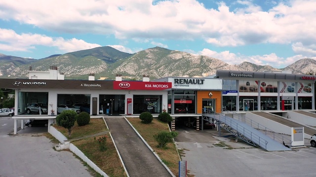 Video Reference: Cloud, Sky, Plant, Mountain, Building, Asphalt, Facade, Rural area, Gas, Commercial building