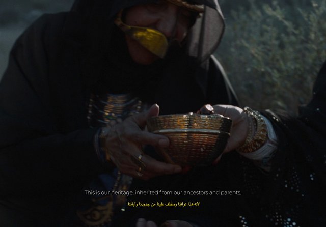 Video Reference: person, traditional clothing, woven bowl, hands, close-up, dim lighting, outdoor, ceremony, heritage, subtitles, bilingual, cultural, hands closeup