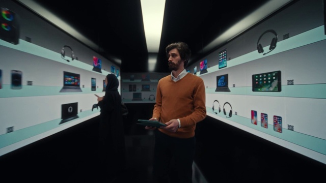 Video Reference: Automotive design, Sleeve, Eyewear, Gadget, Font, Event, Art, Electric blue, Job, Display device