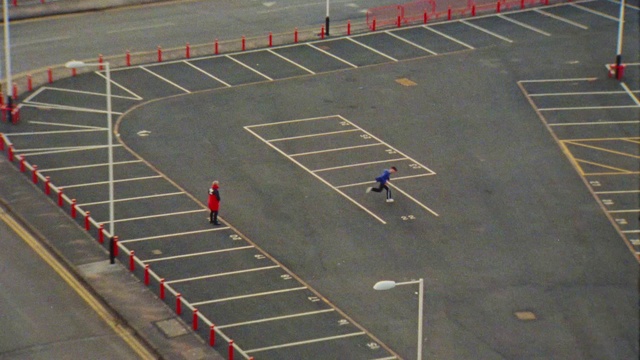 Video Reference: Asphalt, Road surface, Sports equipment, Ball, Grass, Ball game, Sports, Player, Team sport, Competition event