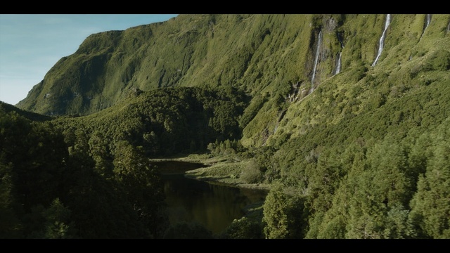 Video Reference: Plant, Natural landscape, Mountain, Sky, Highland, Watercourse, Grass, Terrain, Bedrock, Slope