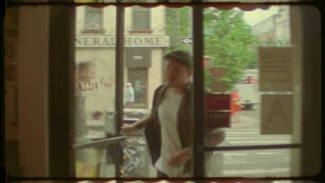 Video Reference: Window, Fixture, Sleeve, Wood, Tree, Tints and shades, Glass, T-shirt, Reflection, Font
