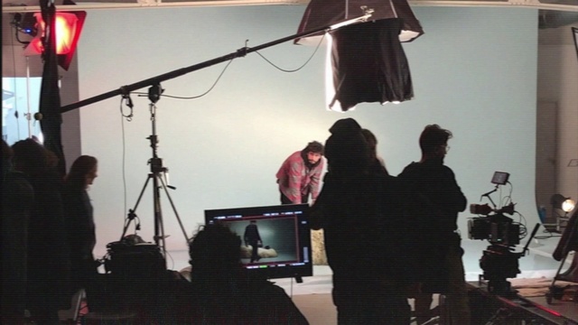 Video Reference: Lighting, Standing, Audio equipment, Entertainment, Jacket, Event, Filmmaking, Computer monitor, Music, Stage equipment