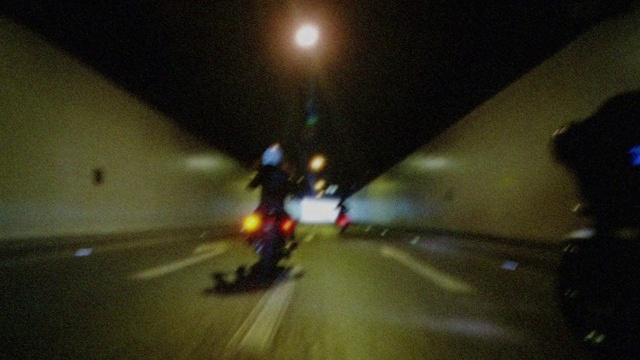 Video Reference: Automotive lighting, Road surface, Motorcycle, Amber, Asphalt, Headlamp, Thoroughfare, Road, Vehicle, Tints and shades