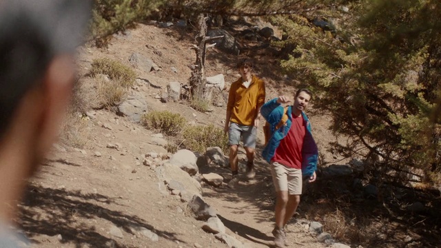 Video Reference: Plant, Shorts, People in nature, Luggage and bags, Travel, Bedrock, Landscape, Mountainous landforms, Geological phenomenon, Recreation