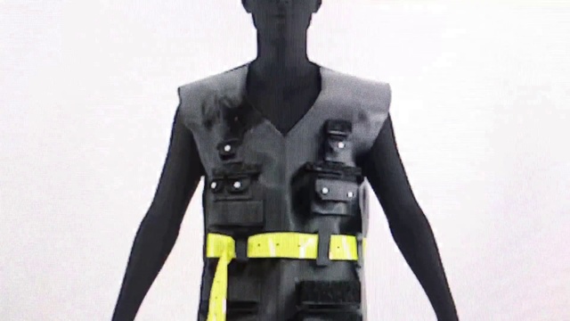 Video Reference: Outerwear, Arm, Shoulder, Toy, Neck, Human body, Workwear, Sleeve, Ballistic vest, Waist
