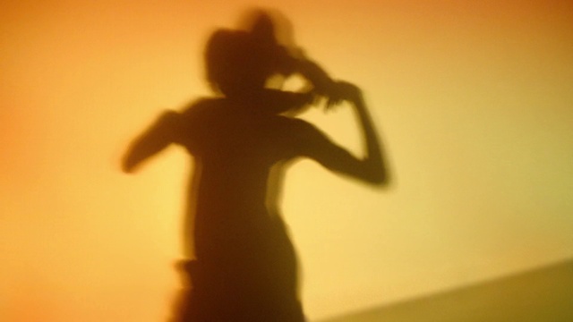 Video Reference: Human body, Sleeve, Gesture, Tints and shades, Backlighting, Shadow, Elbow, Event, Darkness, Heat