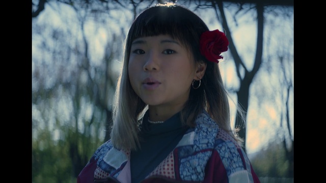 Video Reference: Lip, Outerwear, Plant, People in nature, Flash photography, Branch, Happy, Sky, Street fashion, Black hair