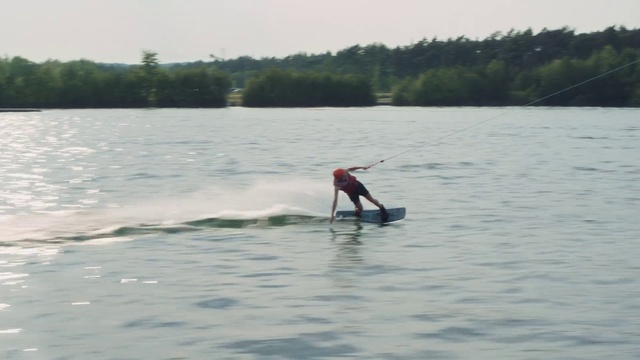 Video Reference: Water, Surfboard, Sky, Towed water sport, Lake, Tree, Wakeboarding, Surfing Equipment, Surfing, Waterskiing
