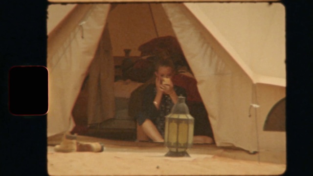 Video Reference: Tent, Water bottle, Wood, Tints and shades, Drinkware, Tarpaulin, Room, Shade, Event, Rectangle