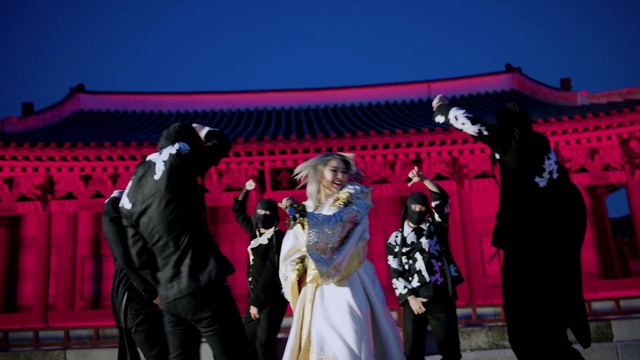 Video Reference: Outerwear, Microphone, Purple, Coat, Hat, Pink, Dress, Sky, Entertainment, Fun