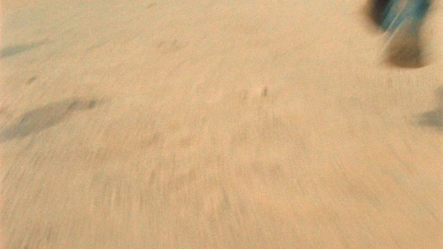 Video Reference: sand, dust, blur, close-up, texture, ground, indistinct, abstract, outdoor