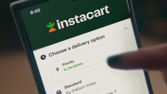 Video Reference: smartphone, instacart, shopping app, delivery options, mobile screen, finger, close-up, online grocery, ecommerce, app interface, checkout, priority delivery, standard delivery