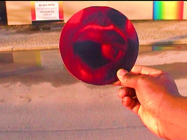 Video Reference: Wheel, Gesture, Wood, Candy apple, Red, Nail, Automotive wheel system, Automotive lighting, Electric blue, Thumb