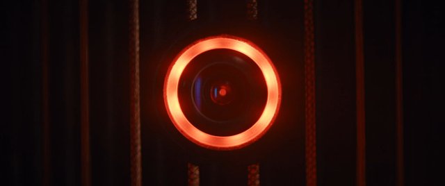 Video Reference: camera, lens, close-up, red light, glowing, dark background, technology, optics, abstract, macro, circular, illumination