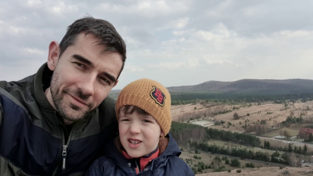 Video Reference: Cloud, Head, Smile, Sky, Outerwear, Happy, Travel, Jacket, Mountainous landforms, Landscape