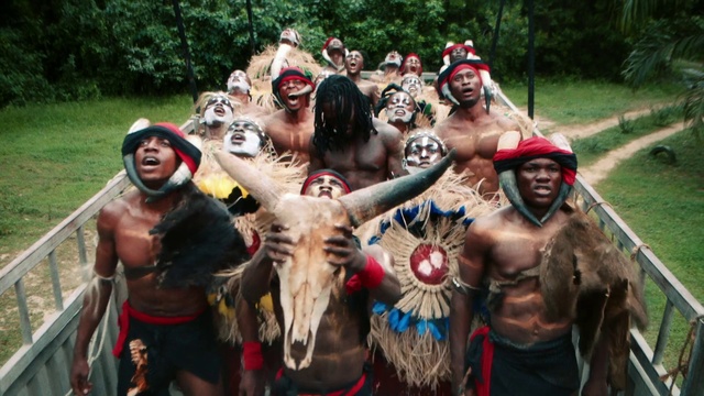 Video Reference: Vertebrate, Muscle, Shorts, Mammal, Hat, Tree, Headgear, Social group, Necklace, Happy