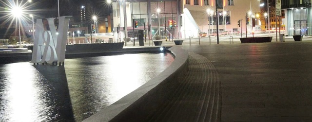 Video Reference: Water, Light, Building, Road surface, Street light, Flooring, Road, City, Water feature, Leisure