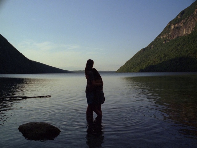 Video Reference: Water, Sky, Cloud, Mountain, Plant, People in nature, Lake, Tree, Gesture, Coastal and oceanic landforms