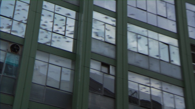 Video Reference: Building, Fixture, Commercial building, Facade, Tints and shades, Window, Glass, Rectangle, City, Pattern