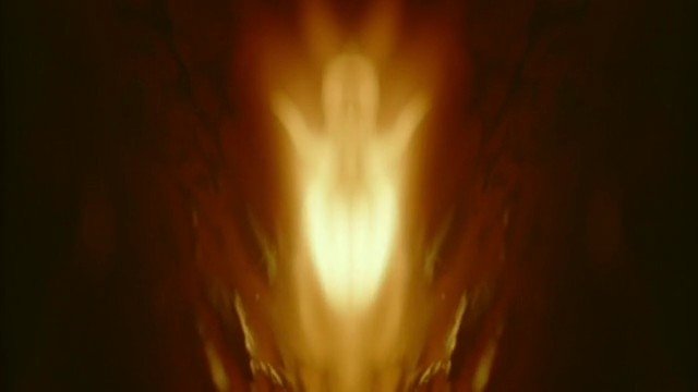 Video Reference: abstract, symmetrical, glow, light, dark background, blurred, aesthetic, warm tones, centered, pattern
