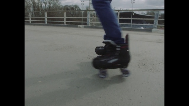 Video Reference: Knee, Asphalt, Rolling, Sneakers, Human leg, Recreation, Electric blue, Automotive wheel system, Thigh, Tree