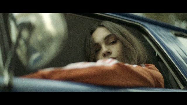 Video Reference: Nose, Hairstyle, Eyebrow, Facial expression, Mouth, Window, Comfort, Flash photography, Automotive design, Vehicle door